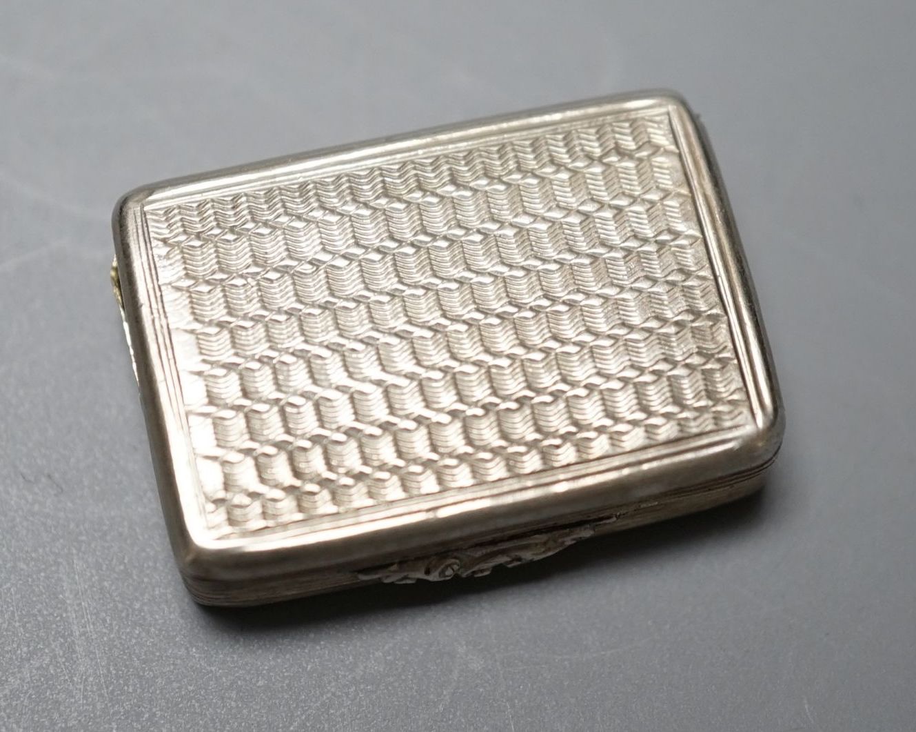 A William IV engraved silver rectangular vinaigrette, Taylor & Perry, Birmingham, 1831, 27mm.